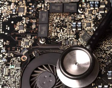 Stethoscope on computer chipset, closeup shot