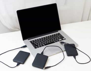 External backup disk hard drive connected to laptop